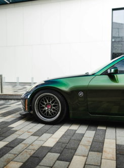 green porsche 911 parked on parking lot during daytime
